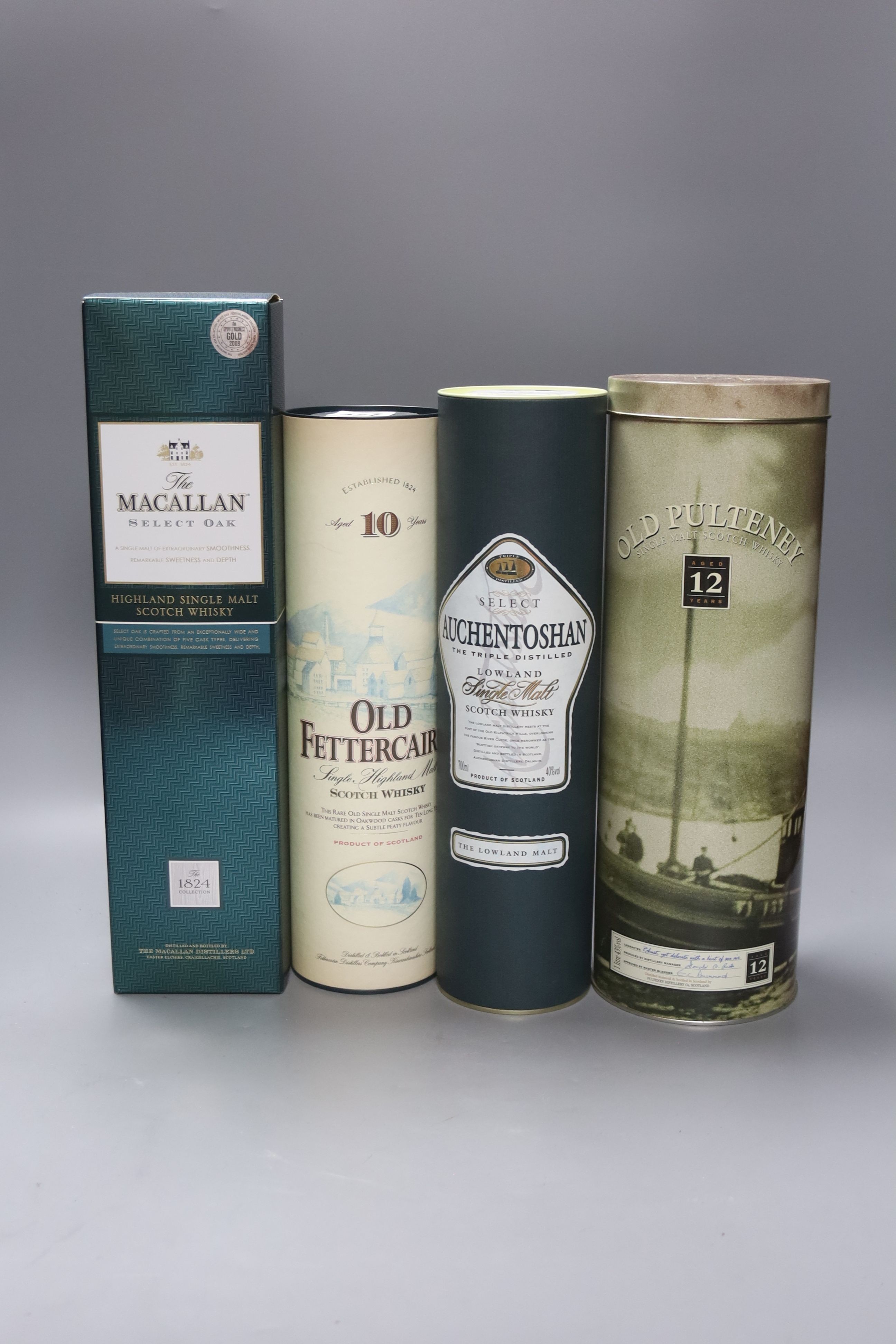 Four assorted malt whiskies- A bottle of Auchentoshan, Macallan Select Oak, Old Fettercairn 10 year old & Old Pulteney 12 year old.